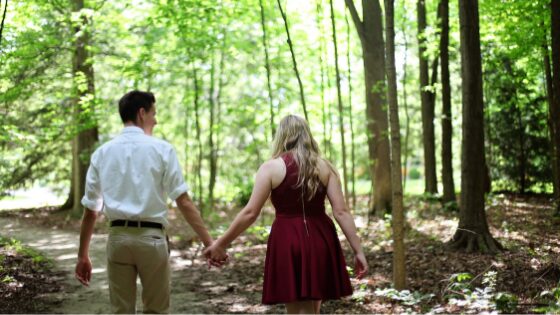 man holding the womans hands