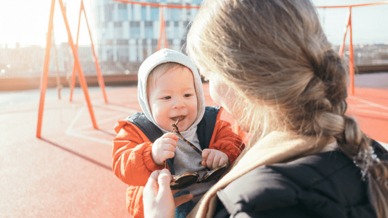 a woman holding a baby