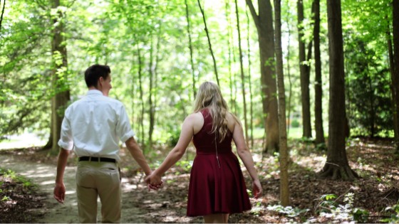 man holding the womans hands