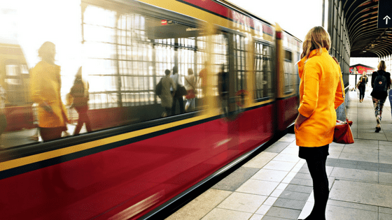 a girl waiting for her train to arrive