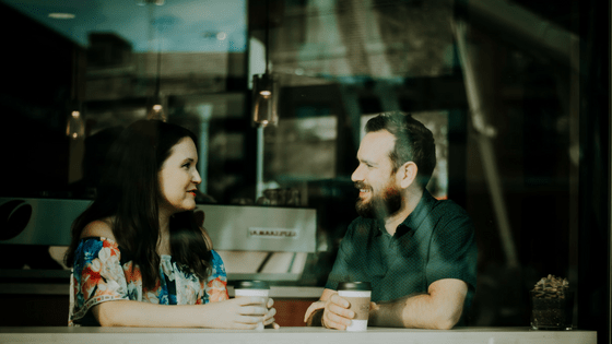 a couple having a good and proper conversation at a coffee shop